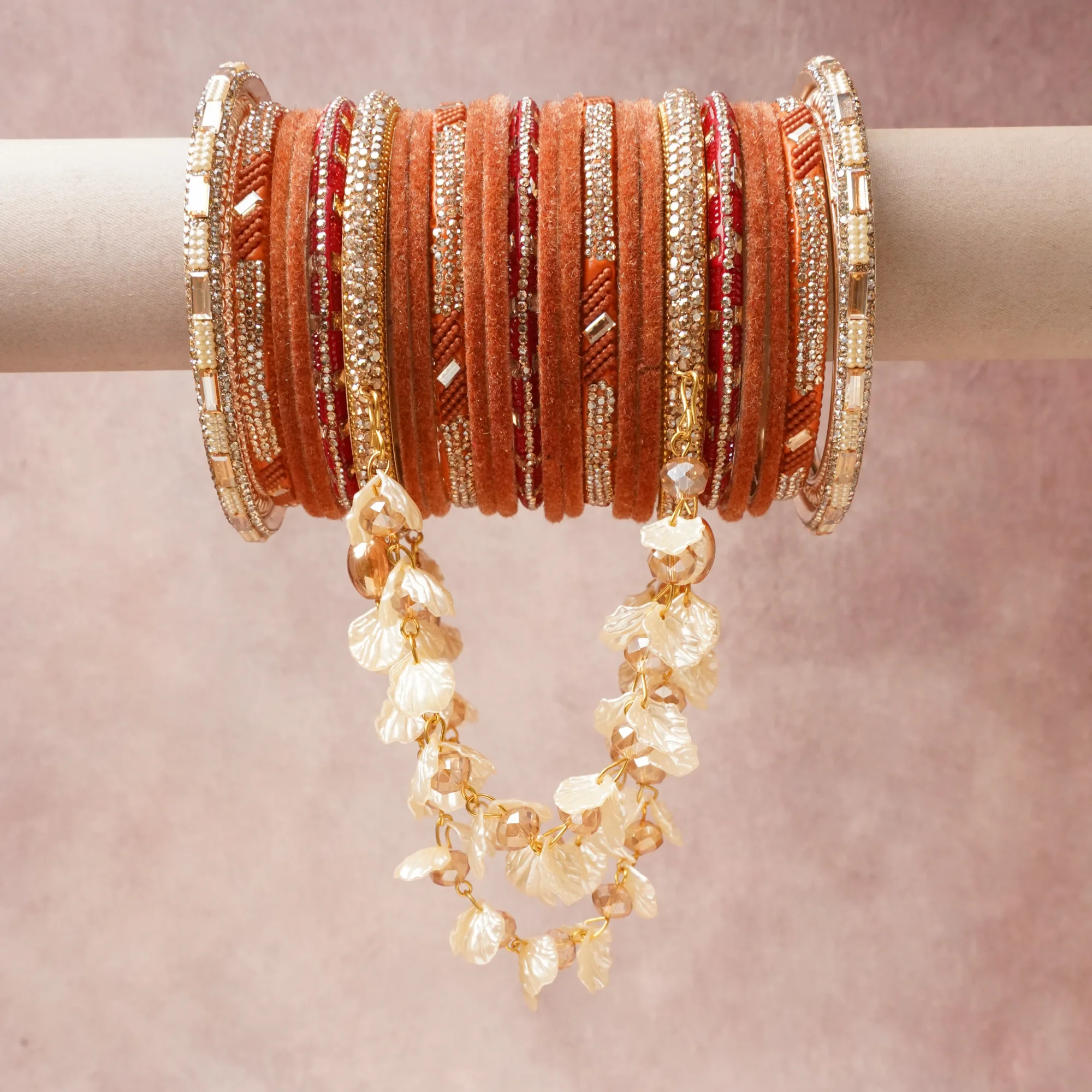 A majestic Sienna Brown set, complemented by Clear Crystal, Gold Tone, Champagne, Pearlescent White featuring Velvet, Metal Alloy, Glass Rhinestones, Iridescent Acrylic, Faceted Acrylic, Lacquer, Faux Pearl.
Rich, ceremonial, and designed to be passed through generations.